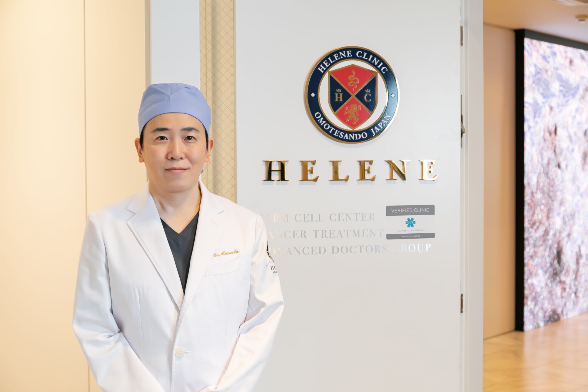 Dr. Takaaki Matsuoka at the entrance of Omotesando Helene Clinic, Tokyo